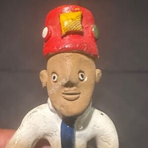 Erra Cotta Ceramic Figurine Lasso with Red Hat, Black Tie White Shirt